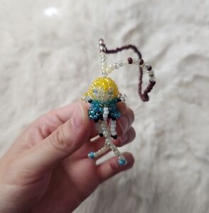 Handmade blue black and yellow beaded little kid charm ( I made it myself)